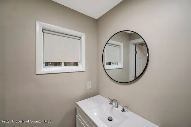 a view of a hallway with closet and cabinet