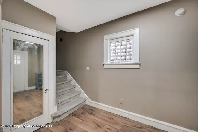 a bedroom with a bed and a mirror