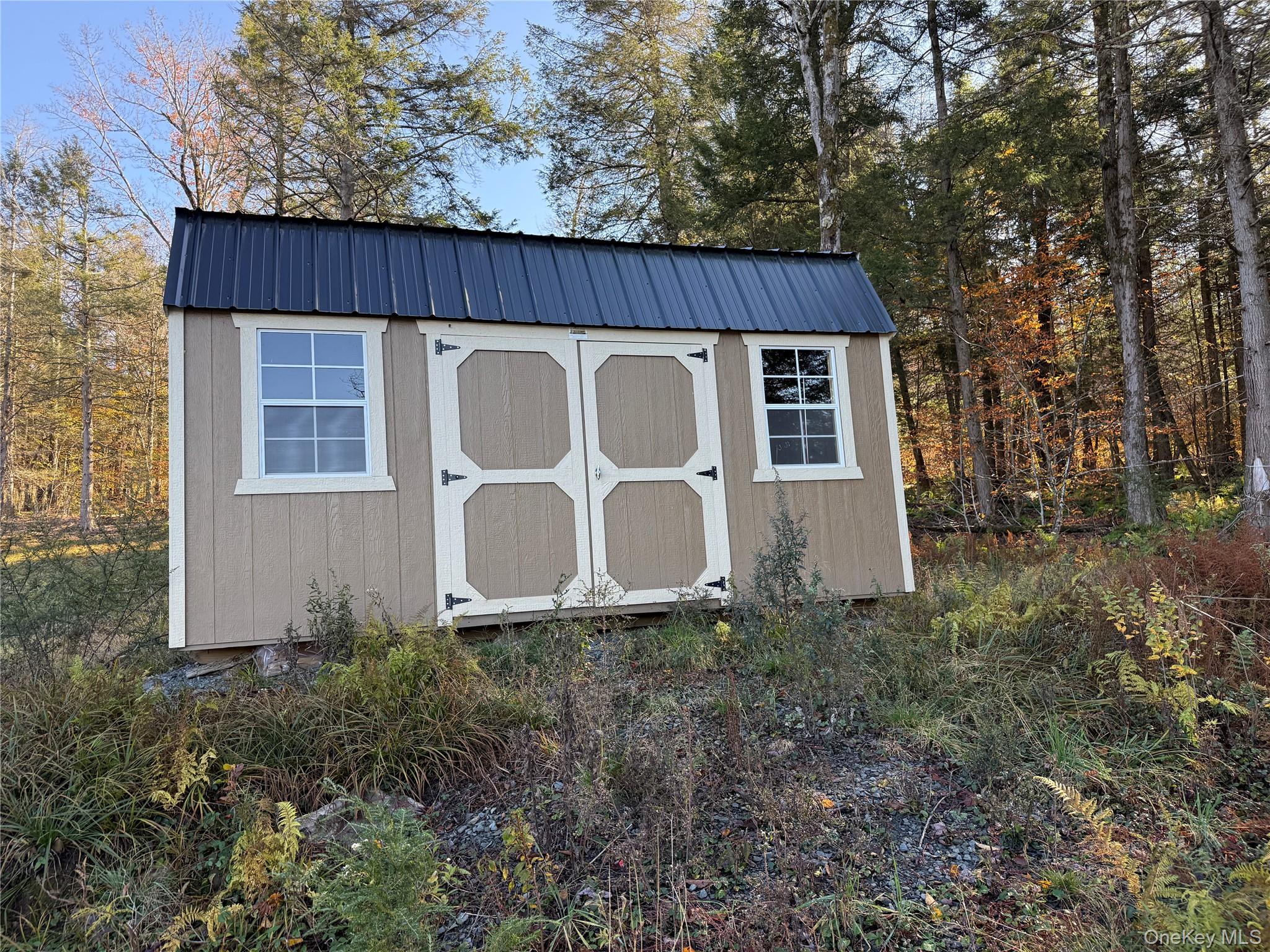 17 Eagles Ridge Way Parksville, NY 12768 - Photo 11 of 15 a front view of a house with garden