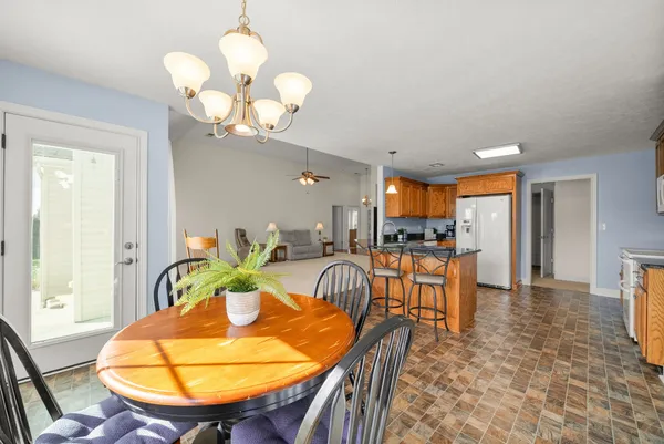 a view of a kitchen with furniture and a window