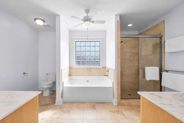 a bathroom with sink bathtub and mirror