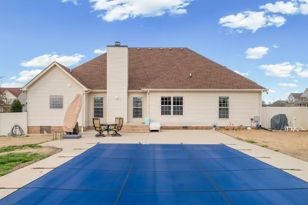 a view of a swimming pool with a patio