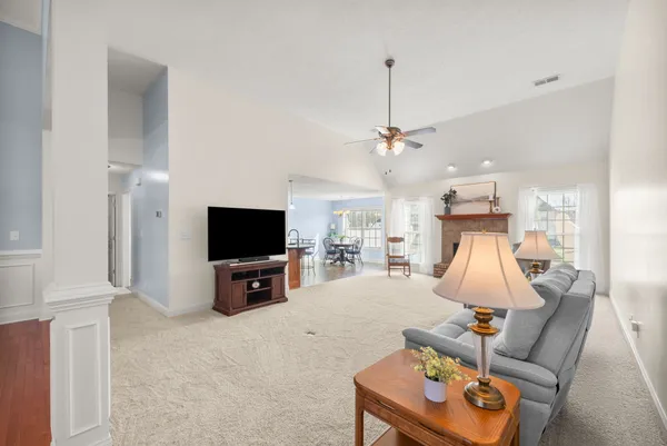 a large living room with furniture and a flat screen tv