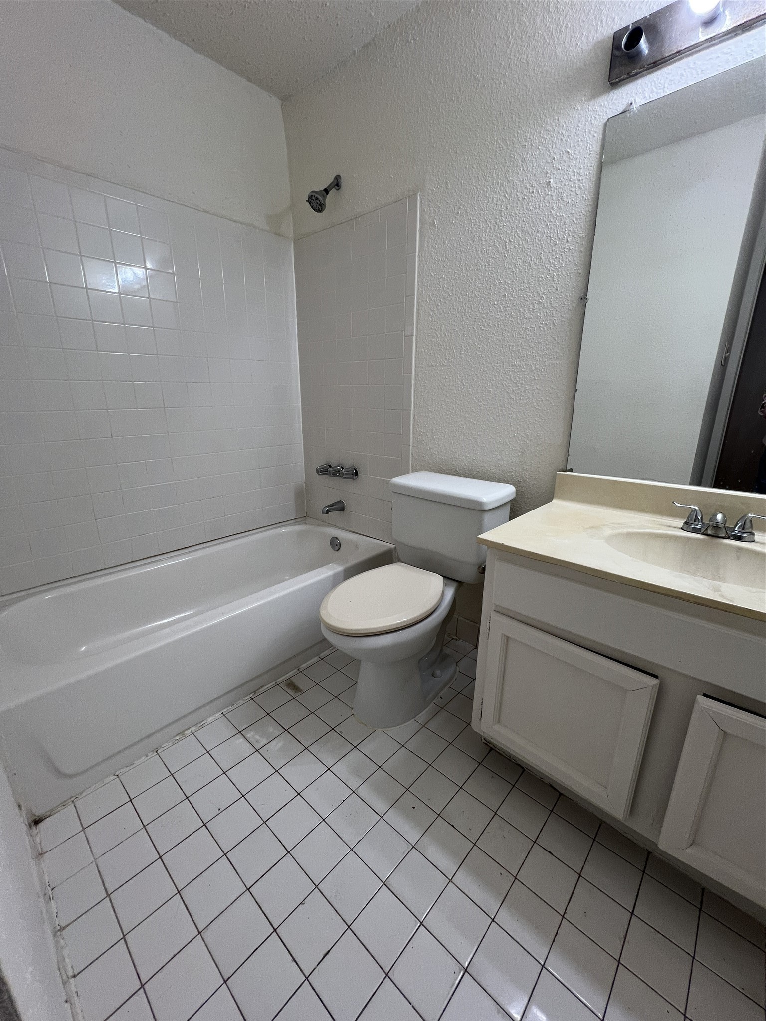 9522 Pagewood Lane, Unit 9522 Houston, TX 77063 - Photo 14 of 22 a bathroom with a sink toilet and shower