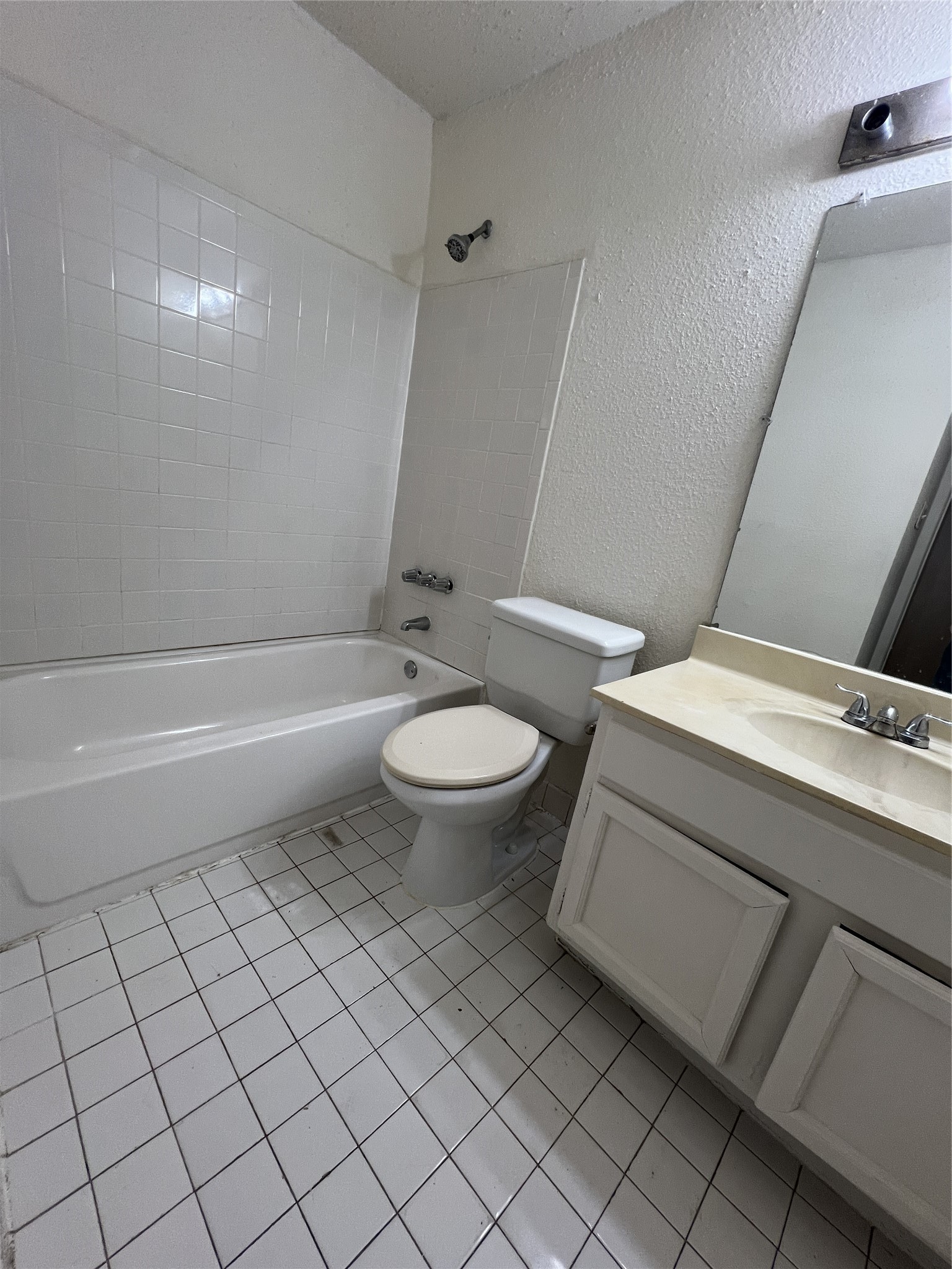 9522 Pagewood Lane, Unit 9522 Houston, TX 77063 - Photo 16 of 22 a bathroom with a toilet and a bathtub