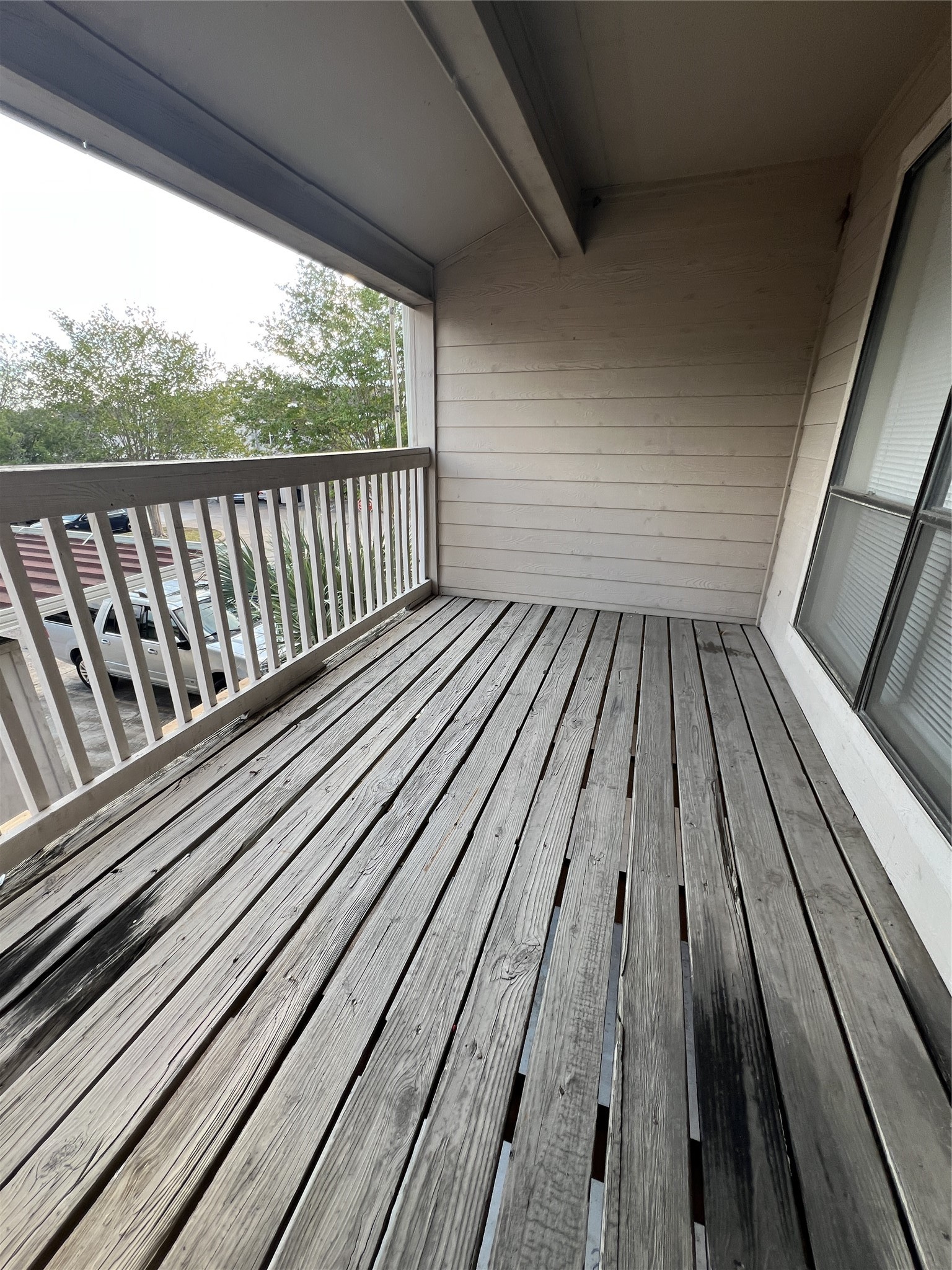 9522 Pagewood Lane, Unit 9522 Houston, TX 77063 - Photo 19 of 22 a view of balcony with wooden floor