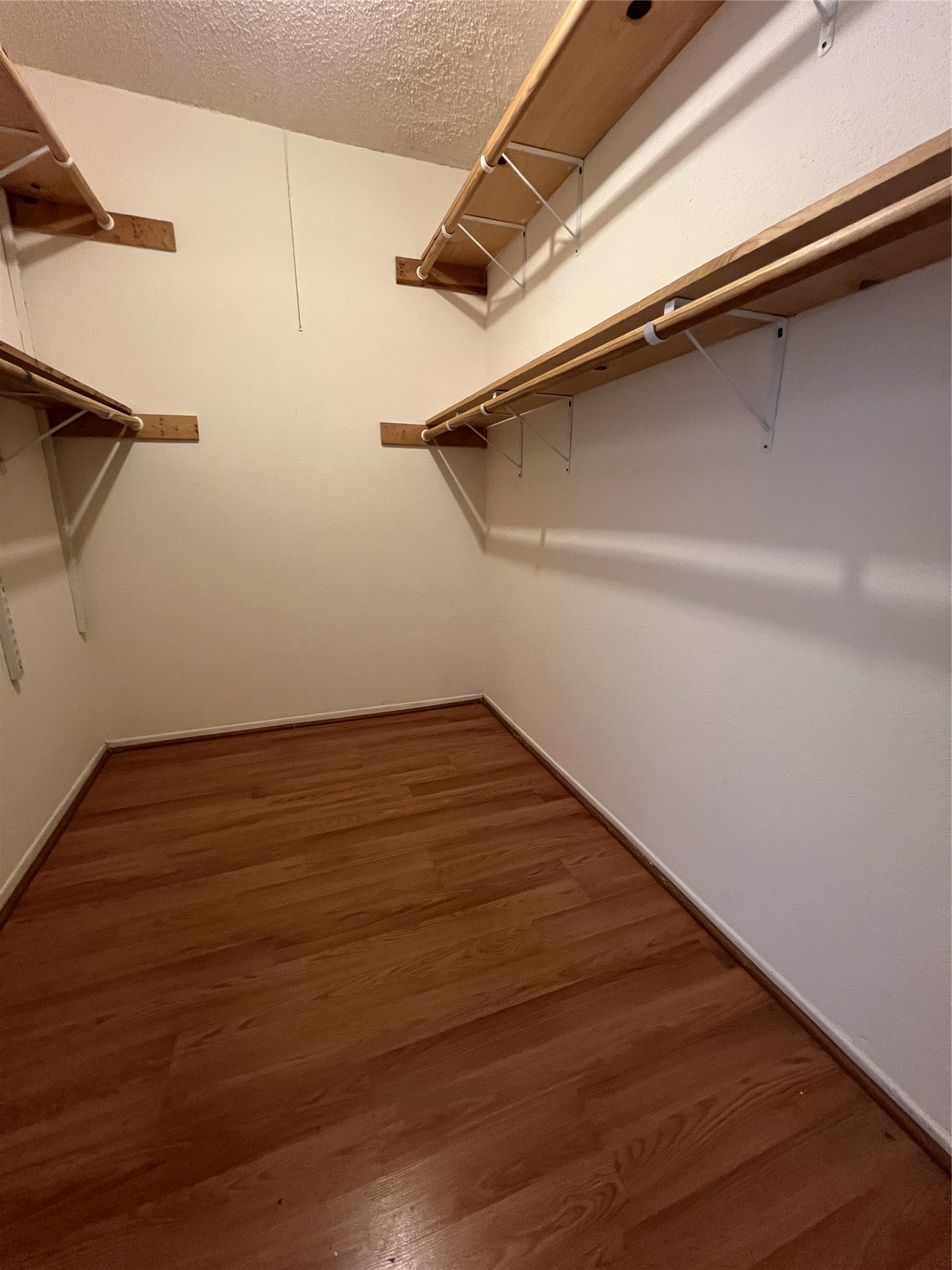 9522 Pagewood Lane, Unit 9522 Houston, TX 77063 - Photo 8 of 22 a view of a room with wooden floor