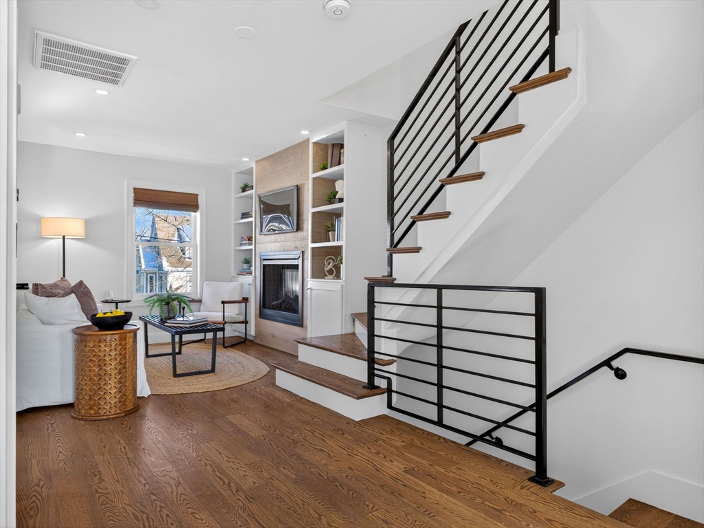 25 Cranston Street, Unit 2 Boston, MA 02130 - Photo 12 of 41 a living room with furniture and a fireplace