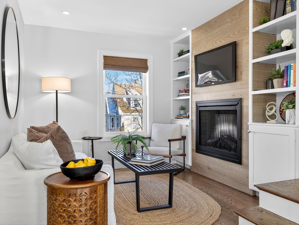 25 Cranston Street, Unit 2 Boston, MA 02130 - Photo 14 of 41 a living room with furniture and a fireplace