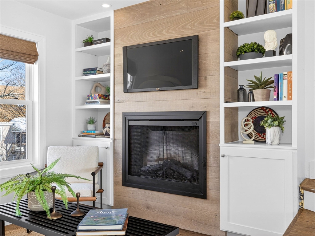25 Cranston Street, Unit 2 Boston, MA 02130 - Photo 15 of 41 a living room with fireplace and flat screen tv
