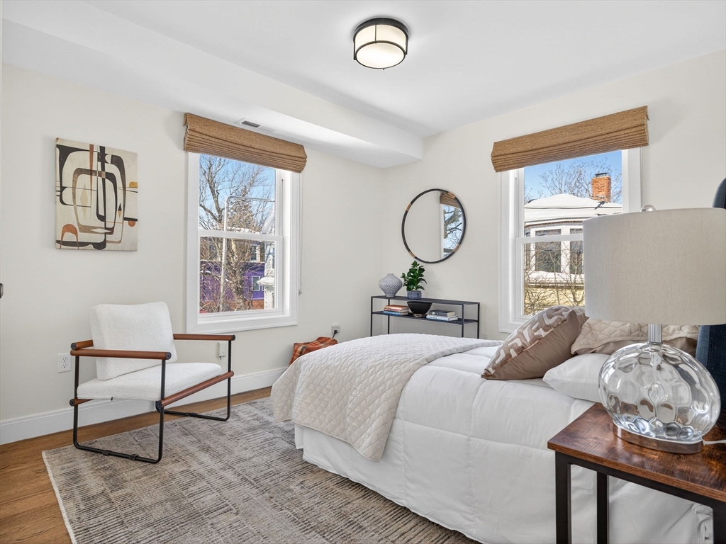 25 Cranston Street, Unit 2 Boston, MA 02130 - Photo 16 of 41 a bedroom with a bed and a chair