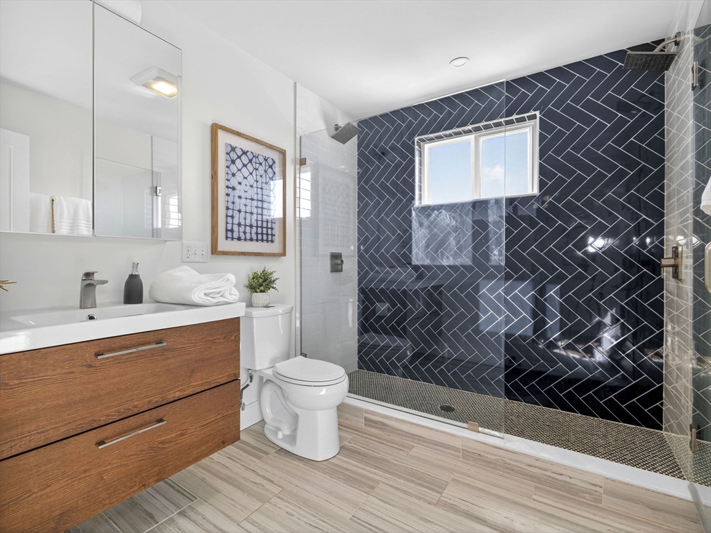 25 Cranston Street, Unit 2 Boston, MA 02130 - Photo 18 of 41 a bathroom with a toilet sink and shower