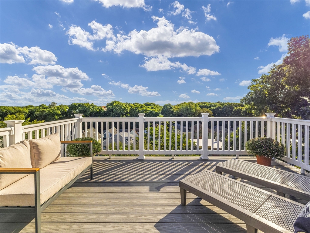 25 Cranston Street, Unit 2 Boston, MA 02130 - Photo 22 of 41 a view of a deck with wooden floor and fence with a bench