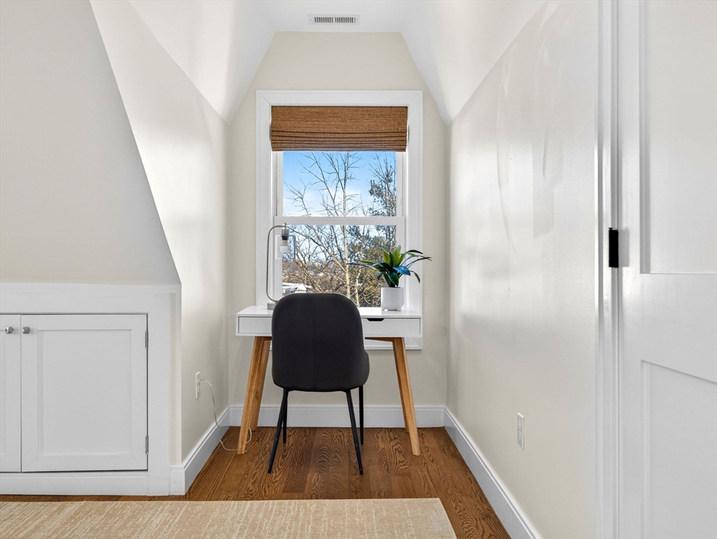 25 Cranston Street, Unit 2 Boston, MA 02130 - Photo 24 of 41 a view of a hallway with furniture and wooden floor