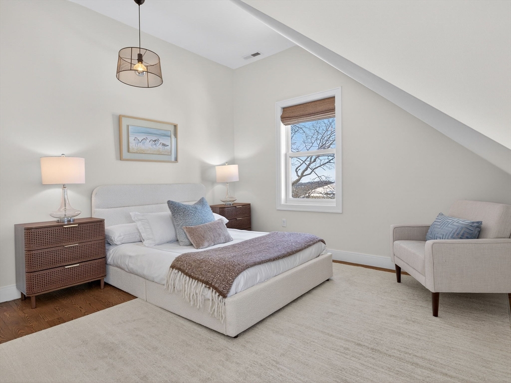 25 Cranston Street, Unit 2 Boston, MA 02130 - Photo 25 of 41 a living room with a bed and a couch