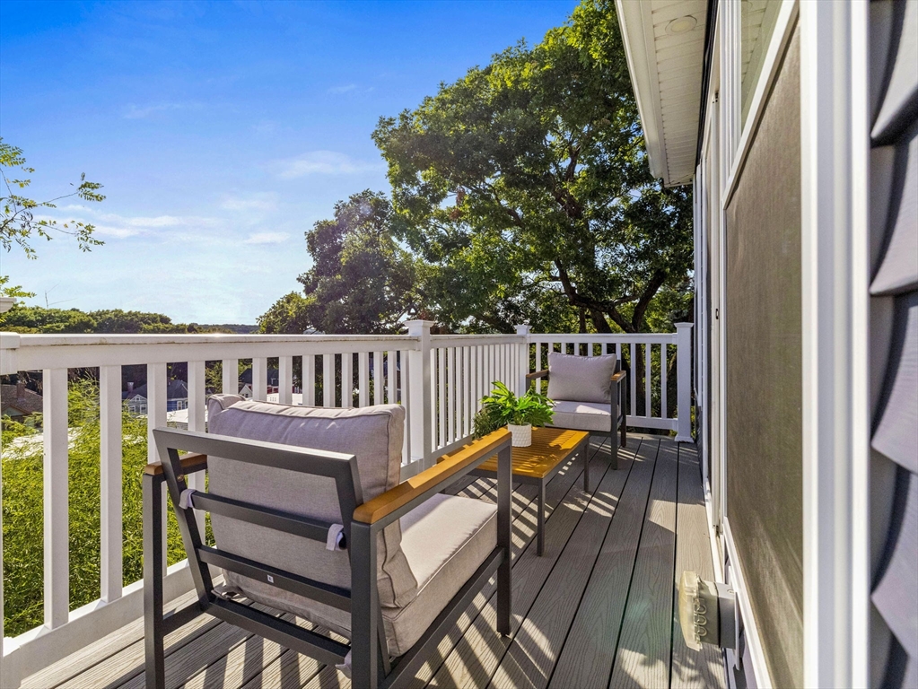 25 Cranston Street, Unit 2 Boston, MA 02130 - Photo 30 of 41 a view of a patio with a table and chairs
