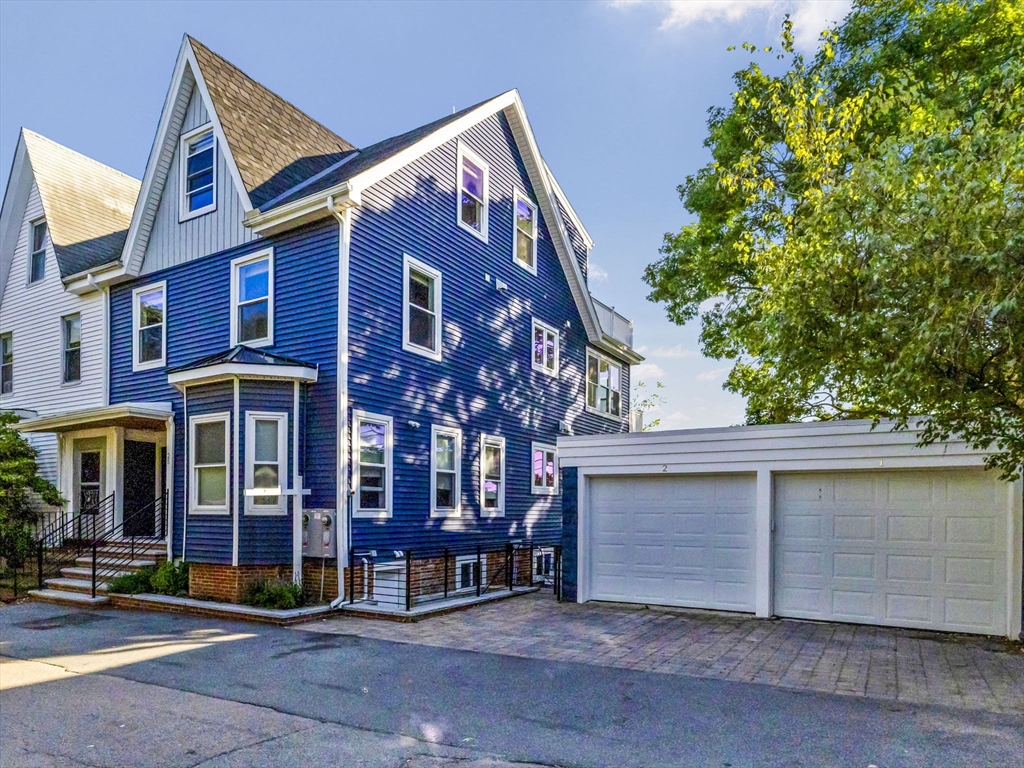 25 Cranston Street, Unit 2 Boston, MA 02130 - Photo 34 of 41 a view of a house with a garage
