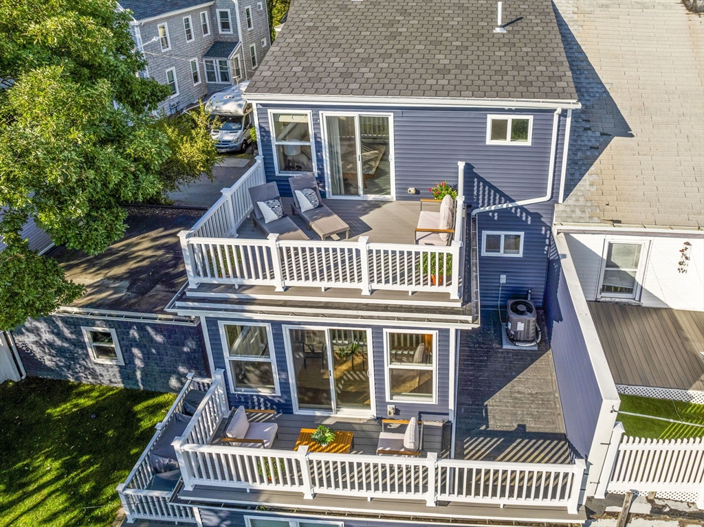 25 Cranston Street, Unit 2 Boston, MA 02130 - Photo 36 of 41 a view of a house with a deck and furniture