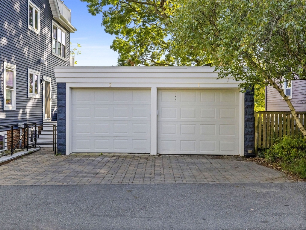 25 Cranston Street, Unit 2 Boston, MA 02130 - Photo 38 of 41 a front view of a house with garage