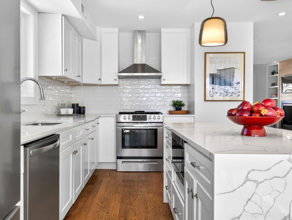 25 Cranston Street, Unit 2 Boston, MA 02130 - Photo 4 of 41 a kitchen with stainless steel appliances granite countertop a stove a sink and a refrigerator