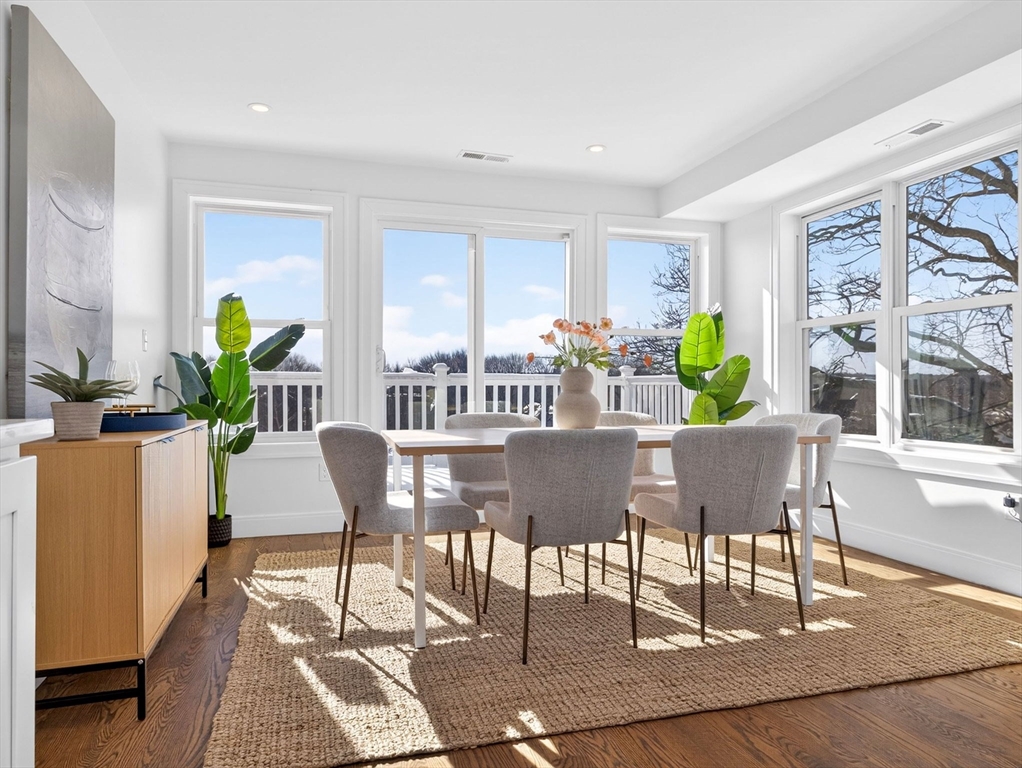 25 Cranston Street, Unit 2 Boston, MA 02130 - Photo 6 of 41 a view of a dining room with furniture and a potted plant
