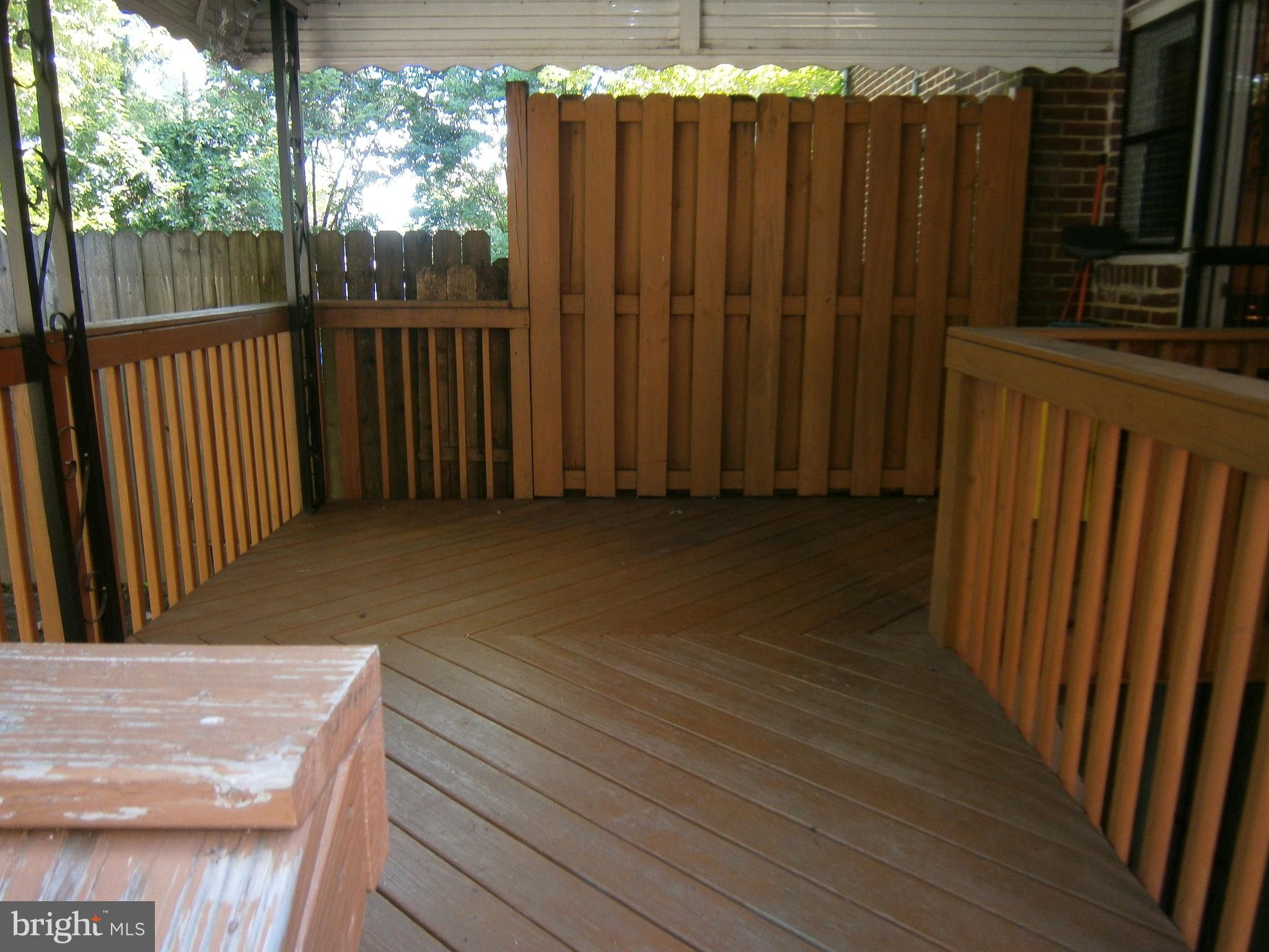 432 South Wickham Road Baltimore, MD 21229 - Photo 22 of 29 a view of a balcony with wooden fence