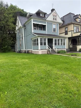 a view of a yard in front of a house