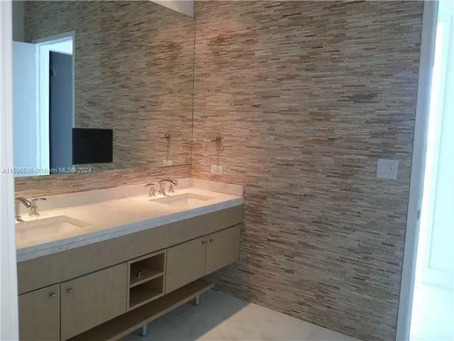 a kitchen with appliances and cabinets