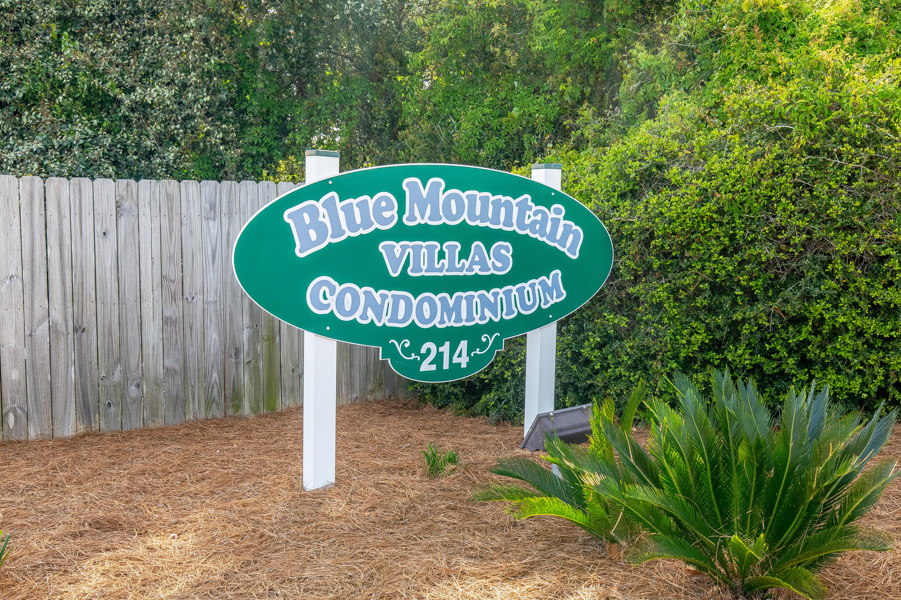 214 Blue Mountain Road, Unit 14 Santa Rosa Beach, FL 32459 - Photo 23 of 24 a sign that is on a wooden wall