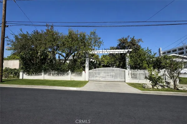 a view of a street with a park