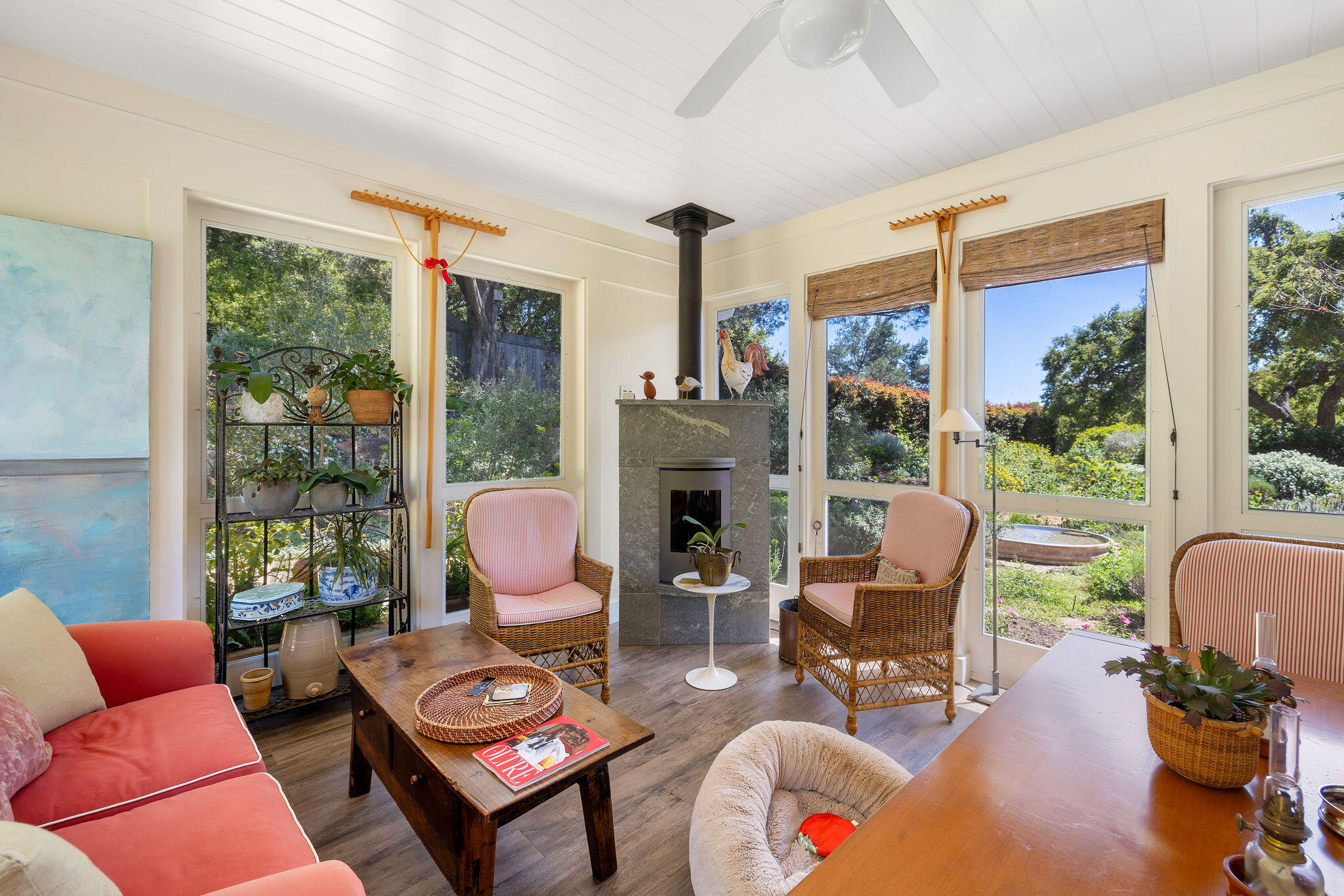 2868 East Valley Road Montecito, CA 93108 - Photo 12 of 34 a living room with furniture a fireplace and floor to ceiling windows