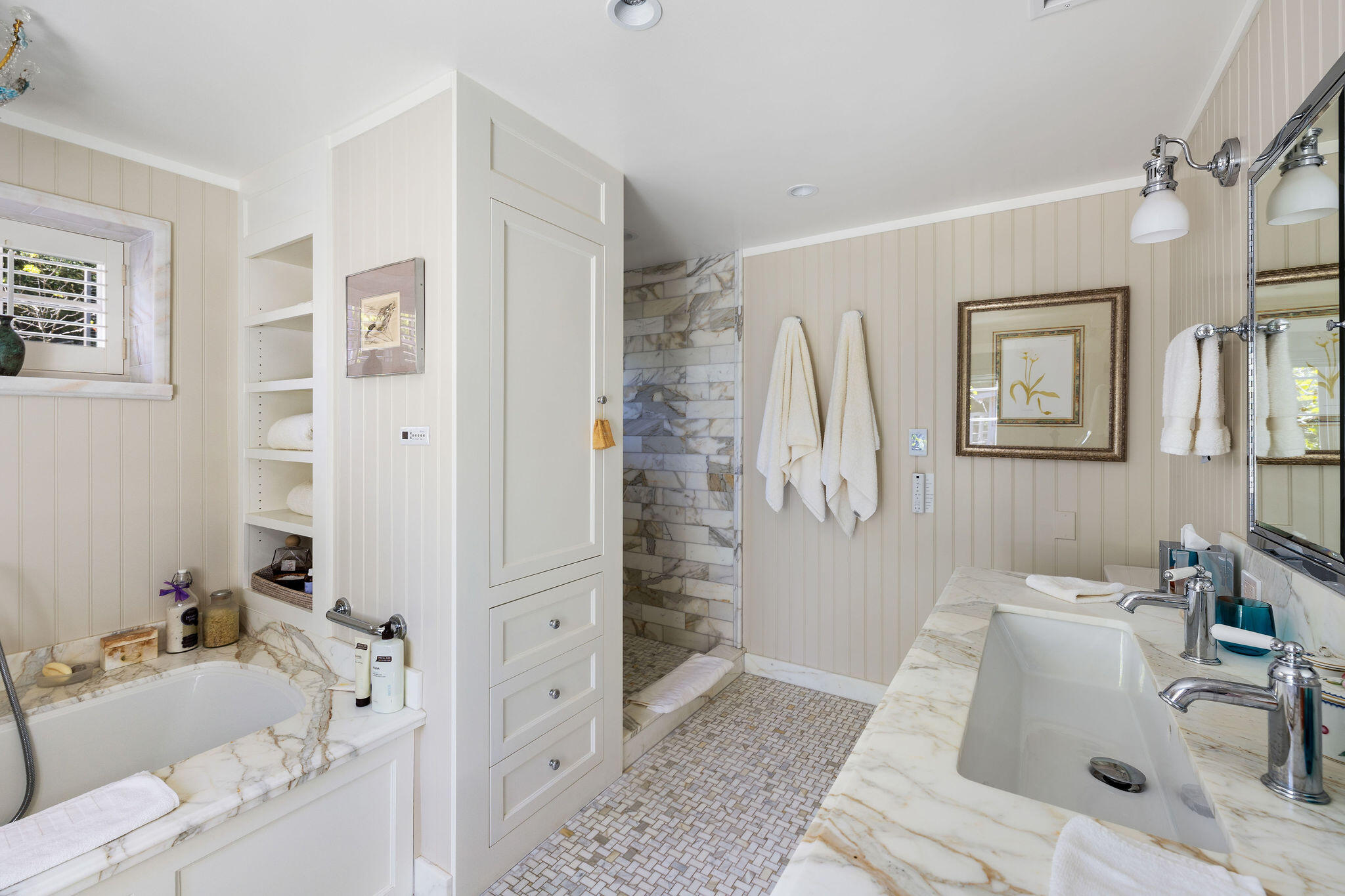 2868 East Valley Road Montecito, CA 93108 - Photo 19 of 34 a bathroom with a bathtub sink and mirror
