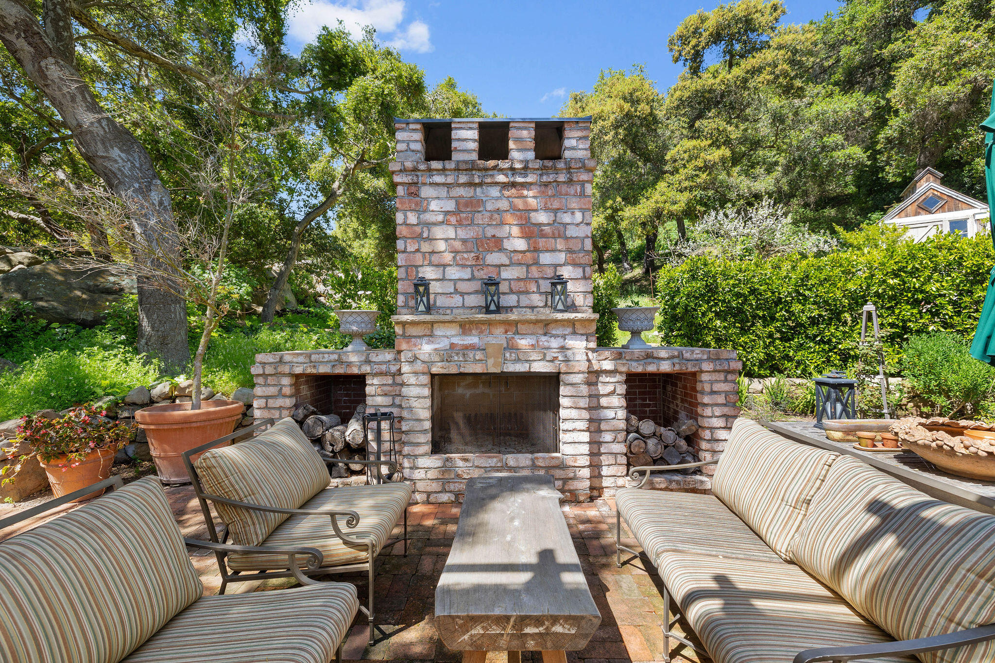 2868 East Valley Road Montecito, CA 93108 - Photo 28 of 34 a view of a patio with couches table and chairs and potted plants