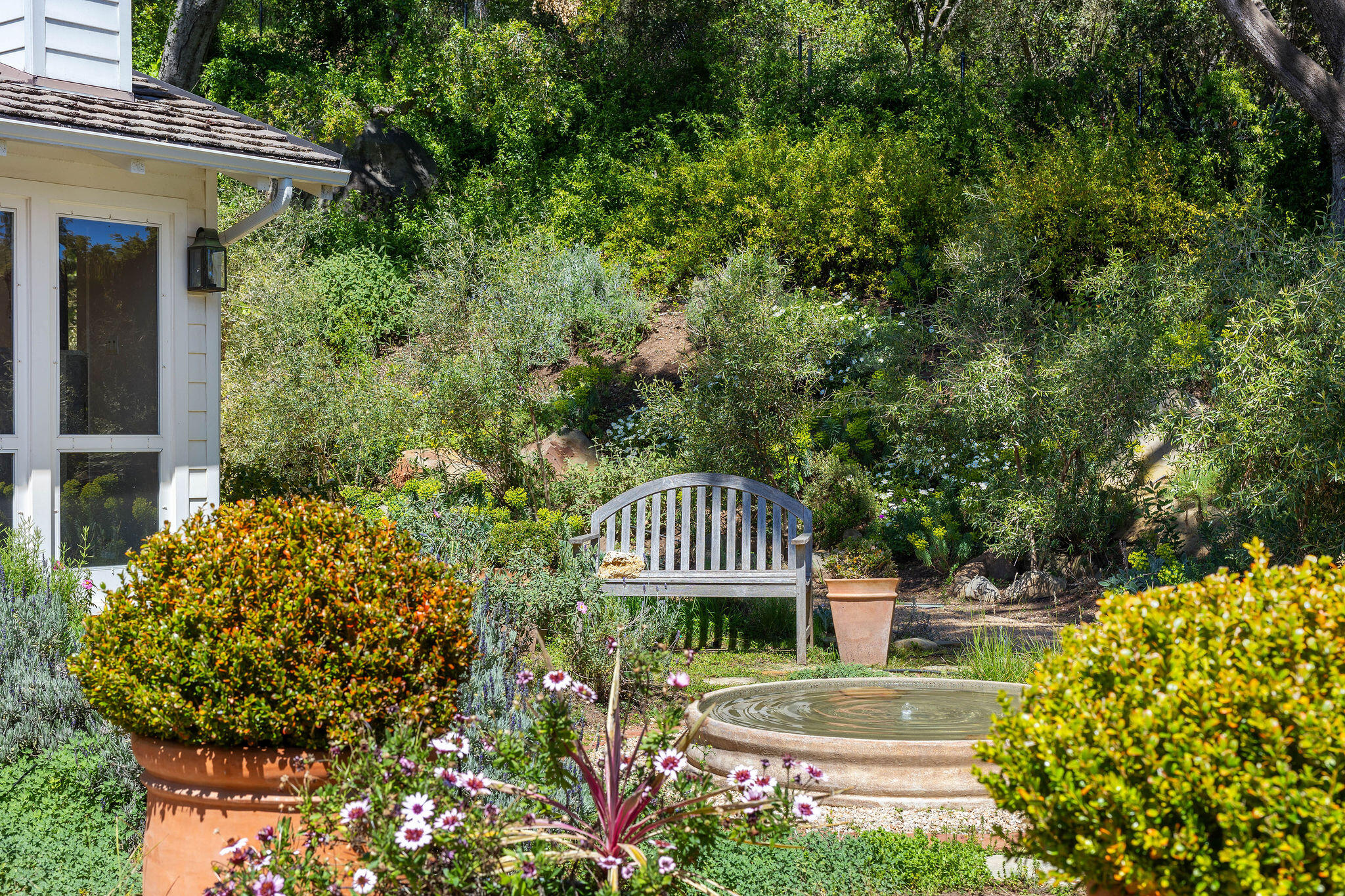 2868 East Valley Road Montecito, CA 93108 - Photo 34 of 34 a front view of a house with a garden