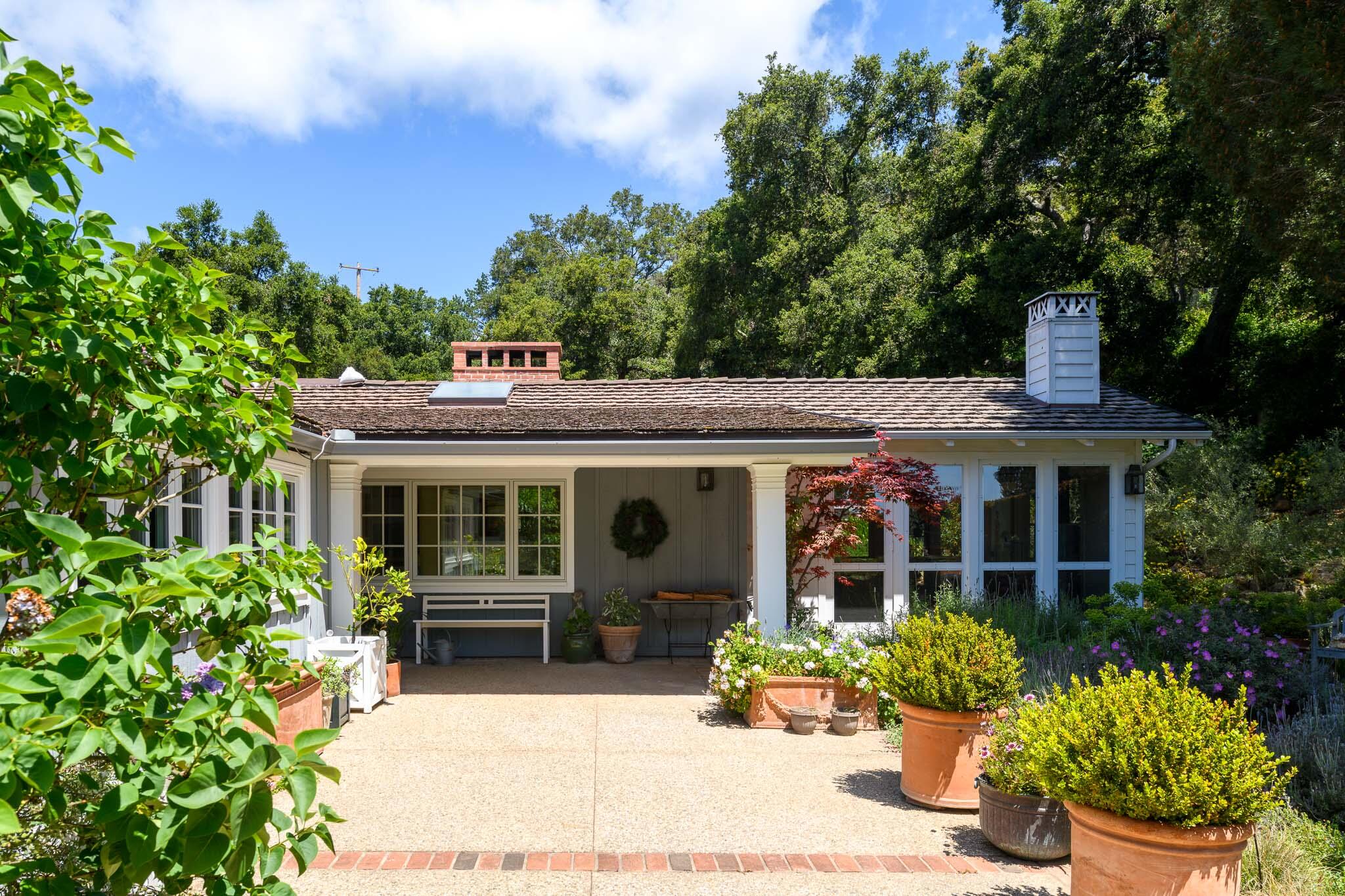 2868 East Valley Road Montecito, CA 93108 - Photo 6 of 34 a front view of a house with a porch