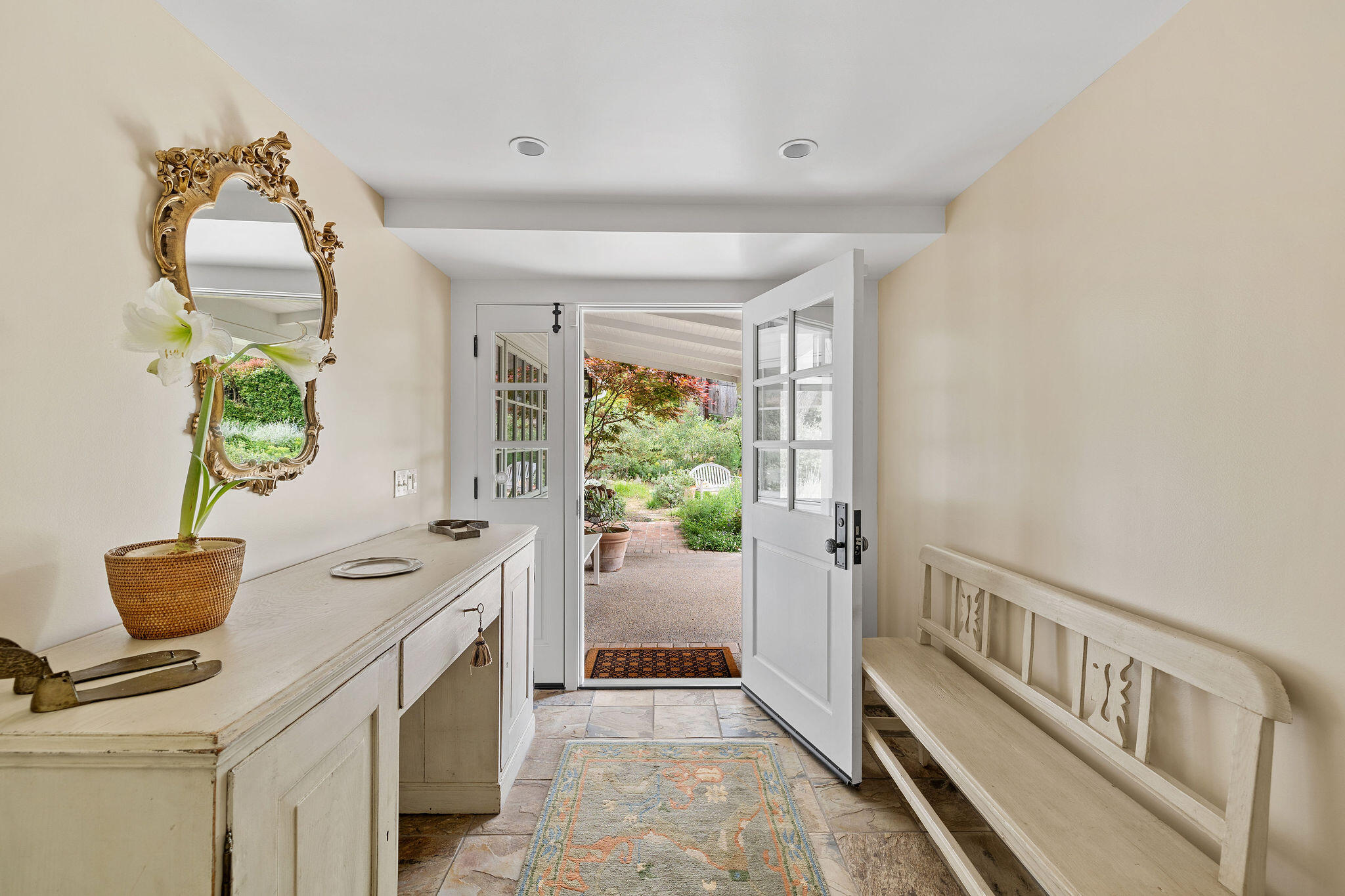 2868 East Valley Road Montecito, CA 93108 - Photo 7 of 34 a hallway with cabinets and wooden floor