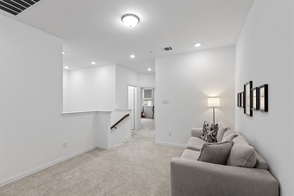 3014 Opera Way Sachse, TX 75048 - Photo 20 of 35 a living room with furniture and a ceiling fan