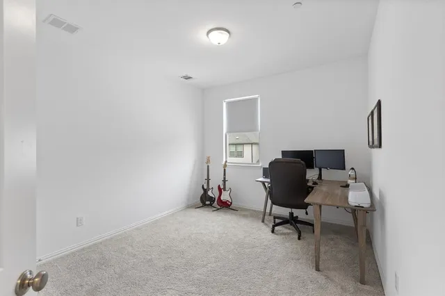 a view of a workspace with furniture