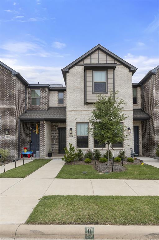 3014 Opera Way Sachse, TX 75048 - Photo 3 of 35 a front view of a house with a yard