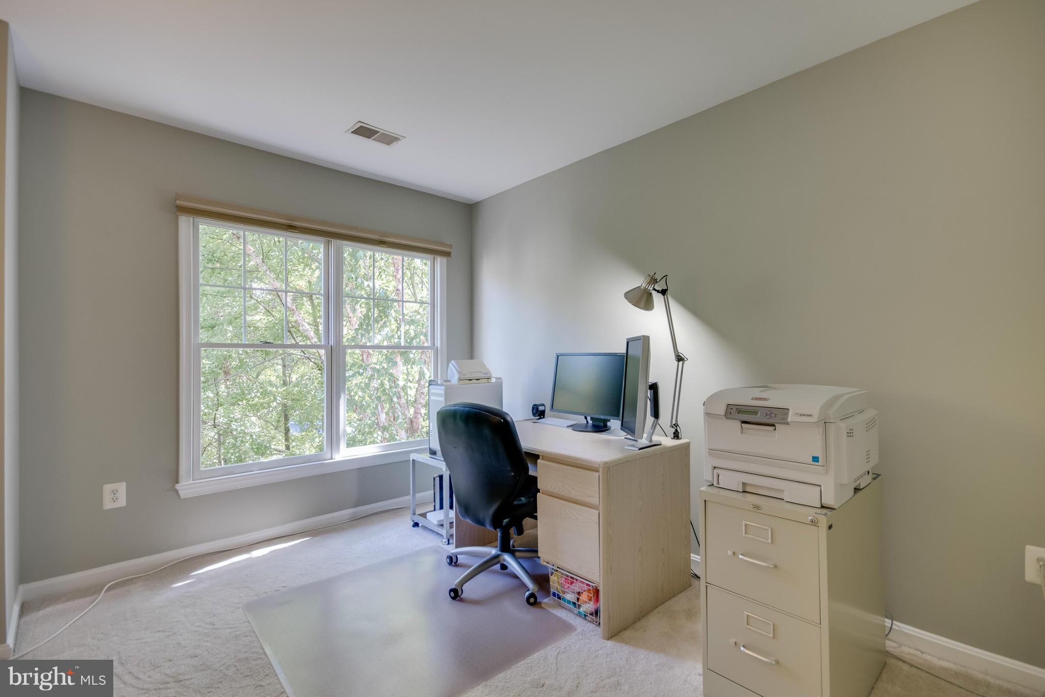 1279 Weatherstone Court Reston, VA 20194 - Photo 20 of 28 a view of a workspace with furniture and a window