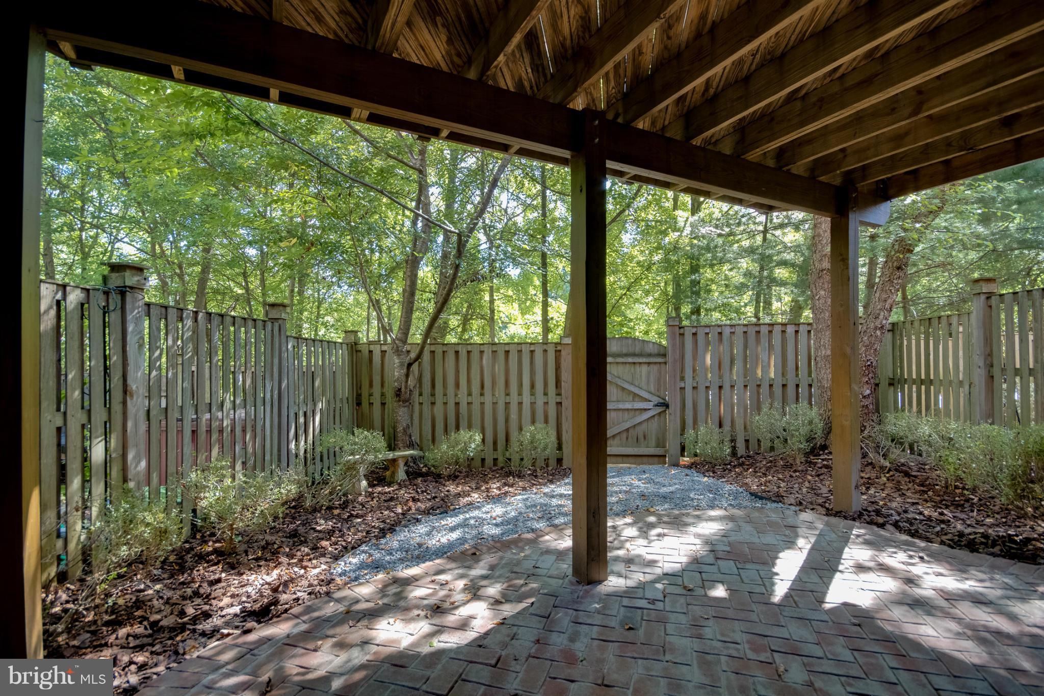1279 Weatherstone Court Reston, VA 20194 - Photo 25 of 28 a backyard of a house with lots of green space