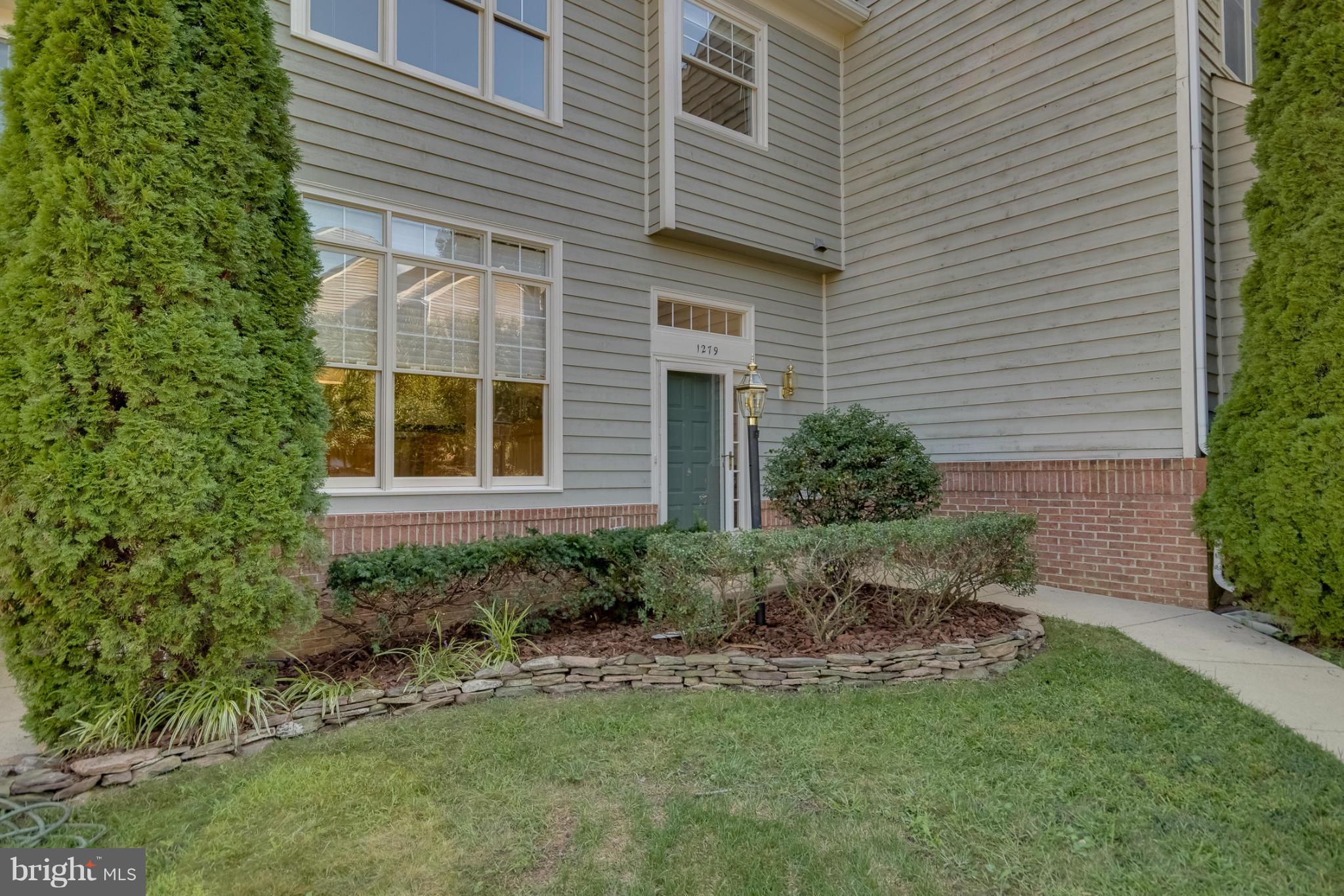 1279 Weatherstone Court Reston, VA 20194 - Photo 28 of 28 a view of a backyard with plants and large tree