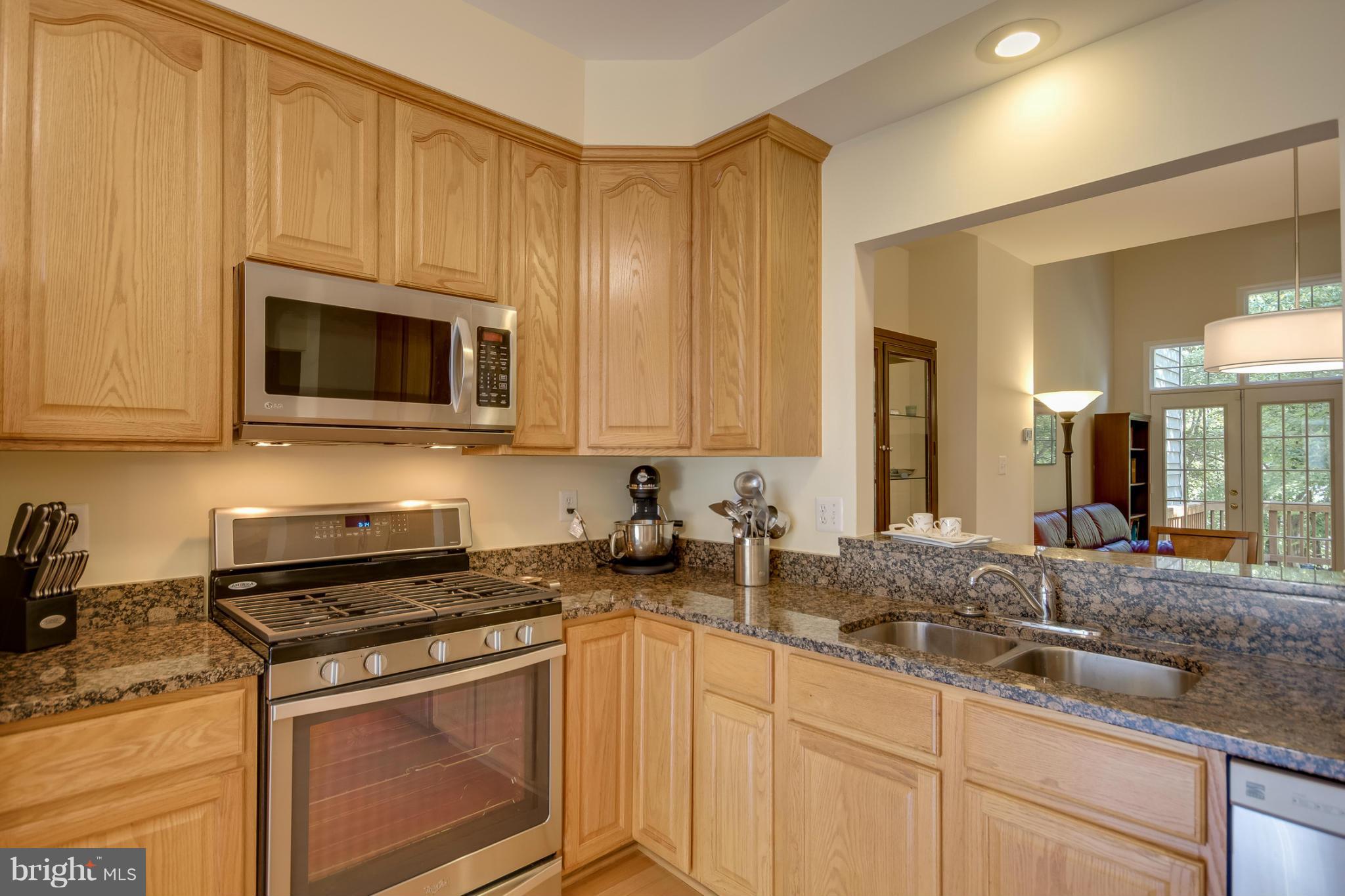 1279 Weatherstone Court Reston, VA 20194 - Photo 5 of 28 a kitchen with appliances a sink and cabinets