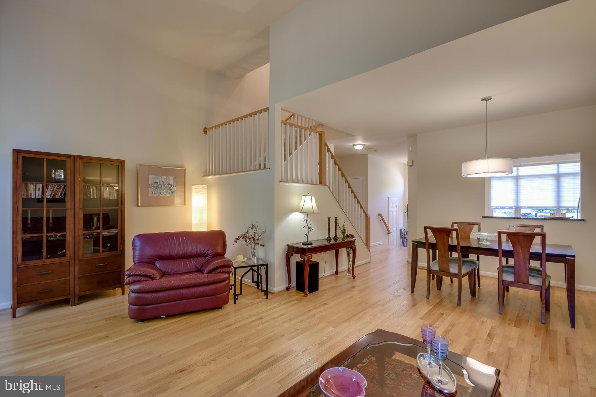 1279 Weatherstone Court Reston, VA 20194 - Photo 10 of 28 a living room with furniture and wooden floor