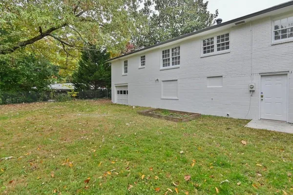 a view of a backyard of the house