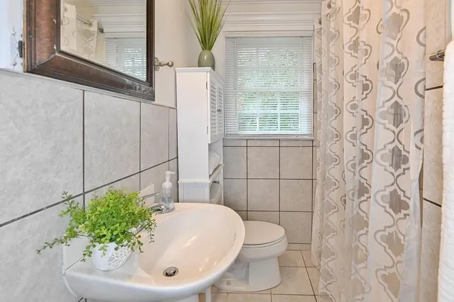 a bathroom with a sink and mirror