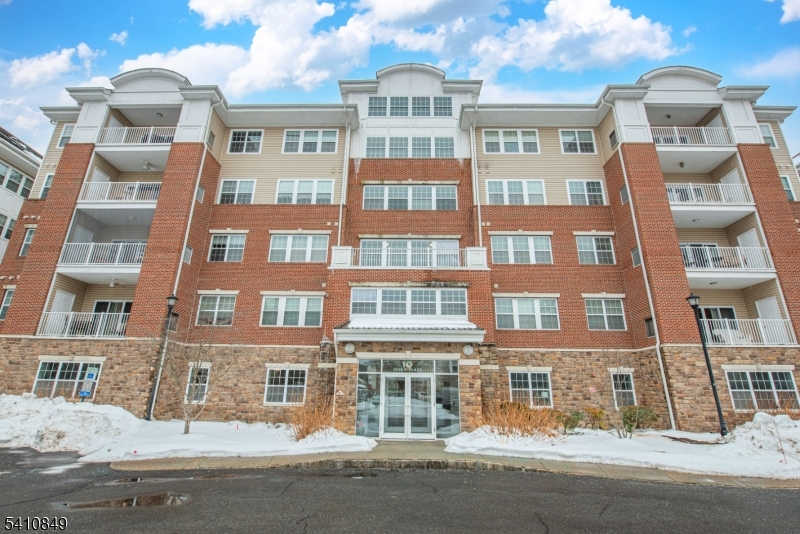 a front view of multi story residential apartment building