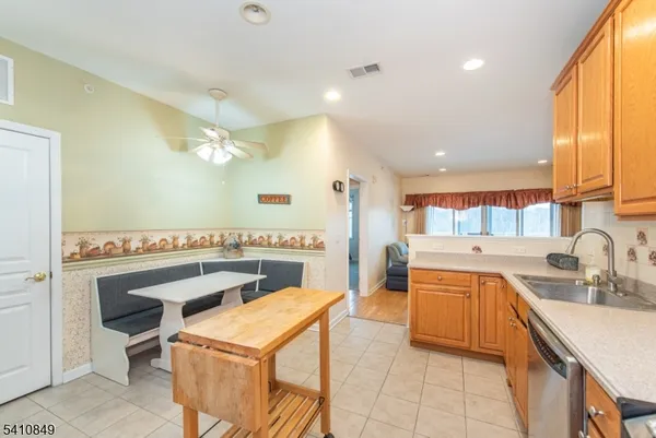 a kitchen with a sink a stove and a refrigerator
