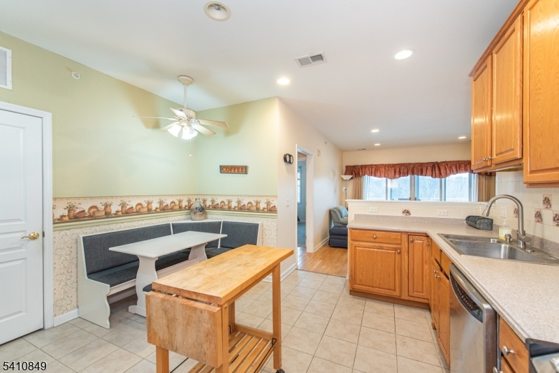 10323 Warren's Way Wanaque, NJ 07465 - Photo 11 of 30 a kitchen with a sink a stove and a refrigerator