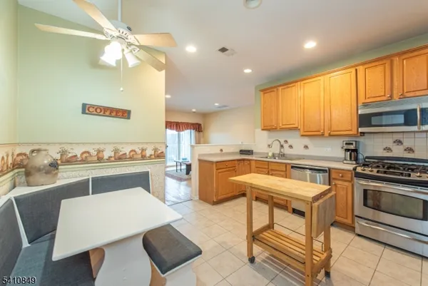 a kitchen with a sink cabinets and window